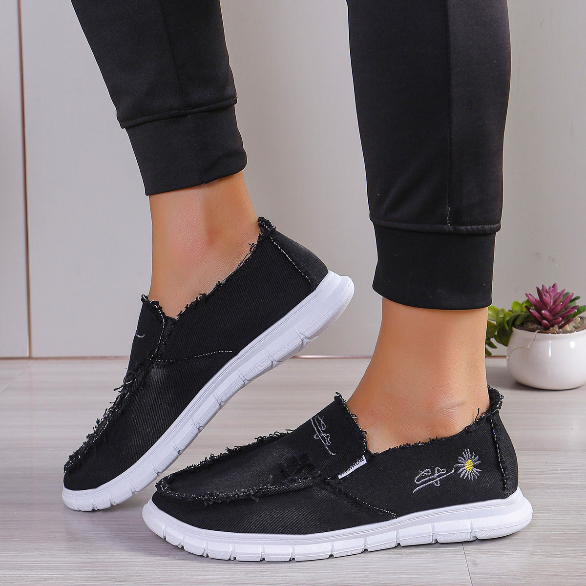 Raw Edge Round Toe Embroidery Flat Slip-Ons Black