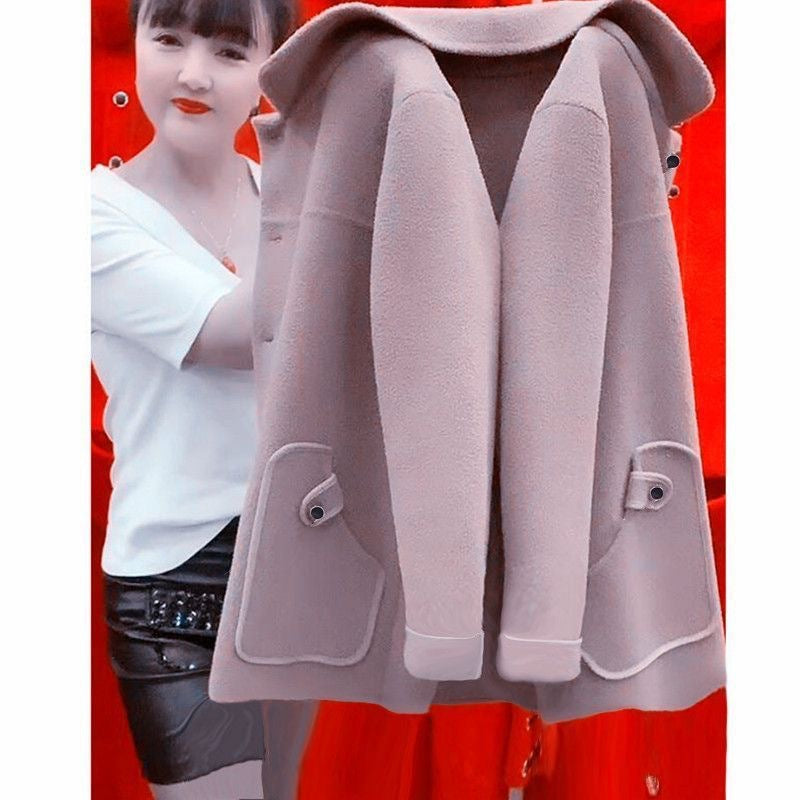 Gray hooded coat displayed against a red background