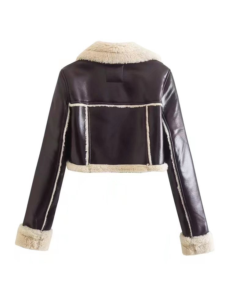 Black leather jacket with beige fur trim on a white background