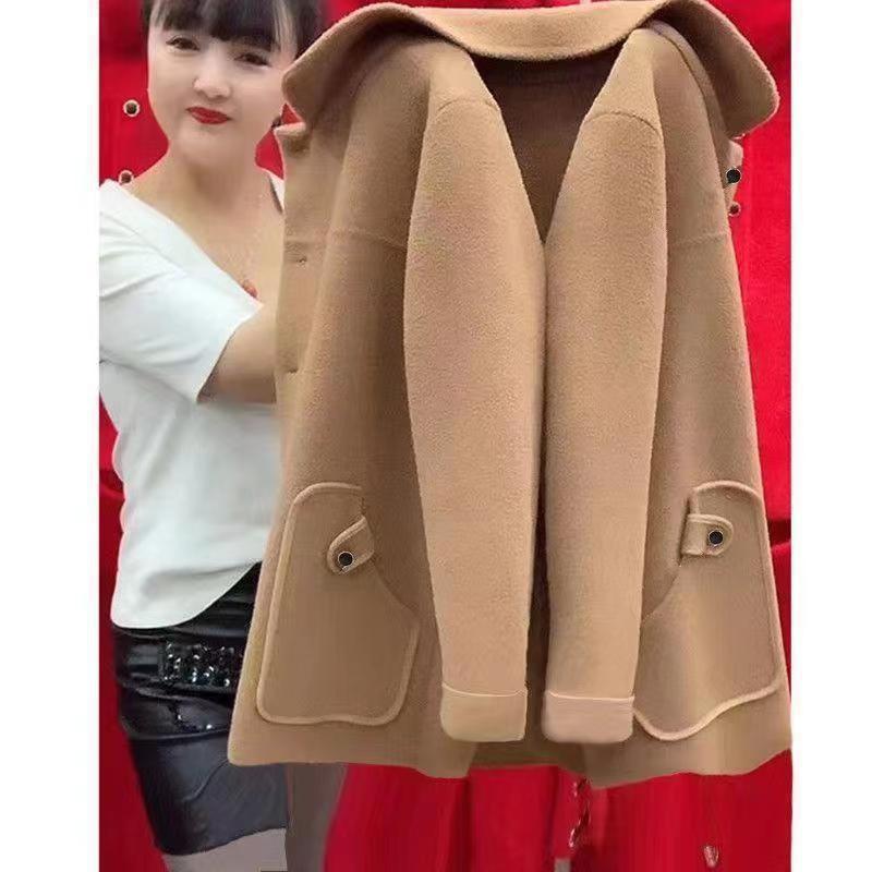 Beige coat displayed against a red background