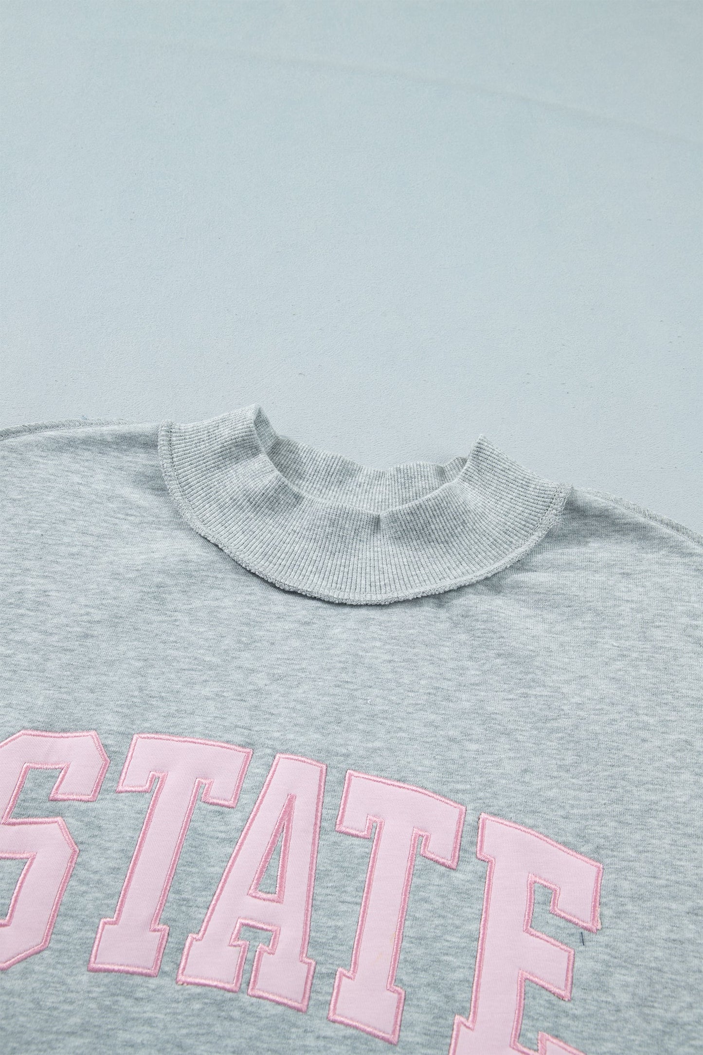 STATE Embroidered Exposed Seam Mock Neck Sweatshirt