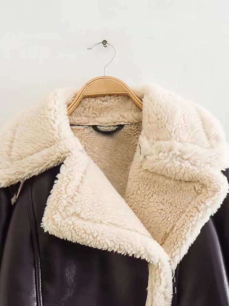 Shearling-lined jacket on a hanger against a white background