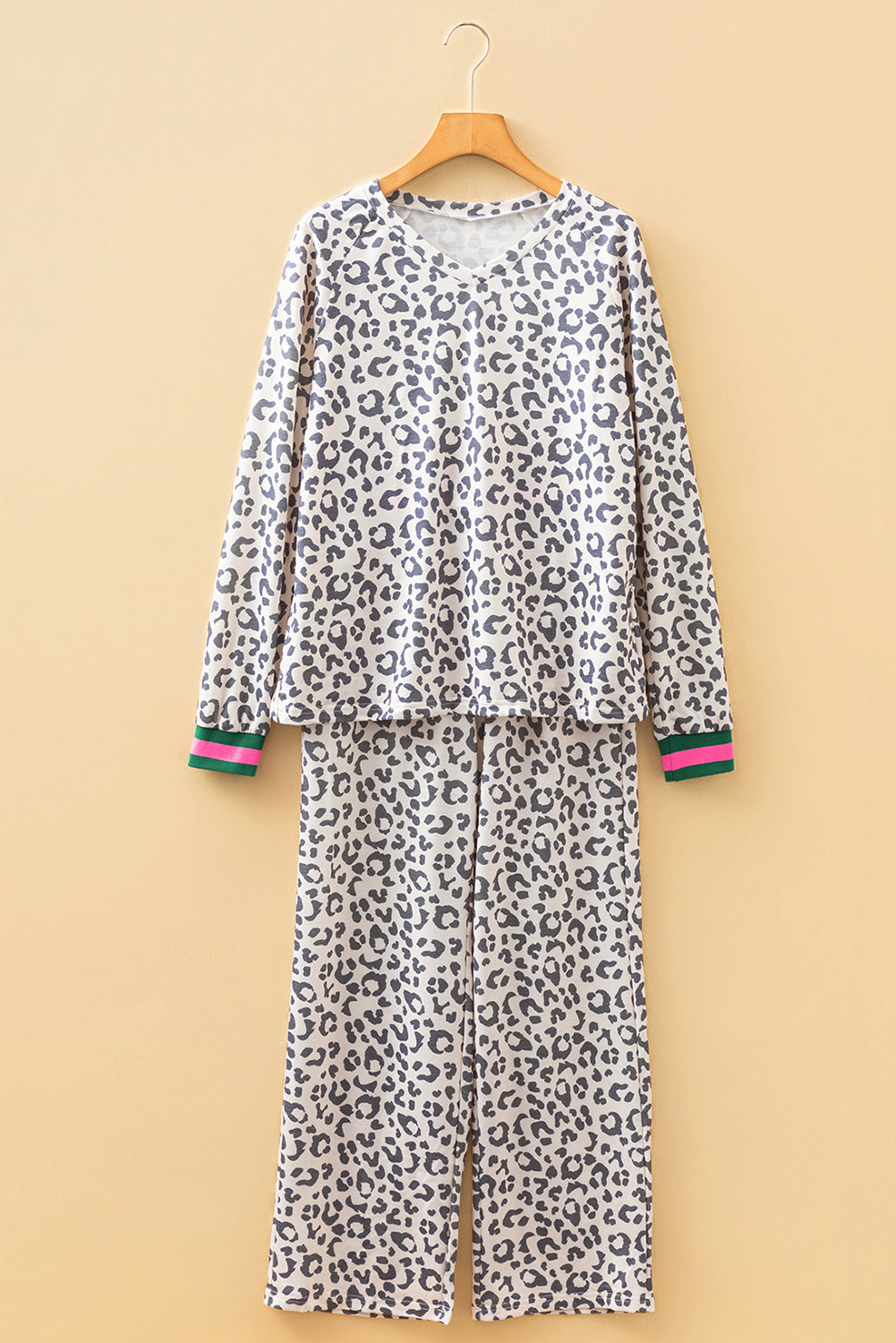 Leopard print pajama set on a beige background