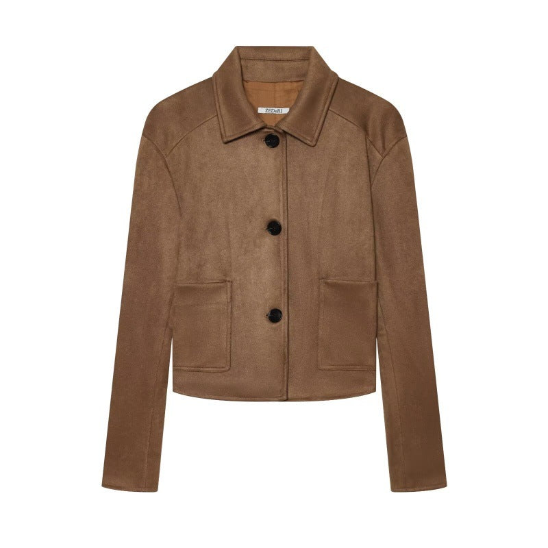 A cropped brown suede jacket with a pointed collar, three-quarter sleeves, and two front flap pockets, shown on a plain white background.